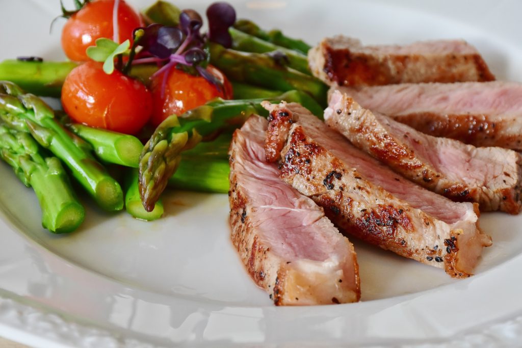 Grilled meat and vegetables indicating mindful nutritional choices